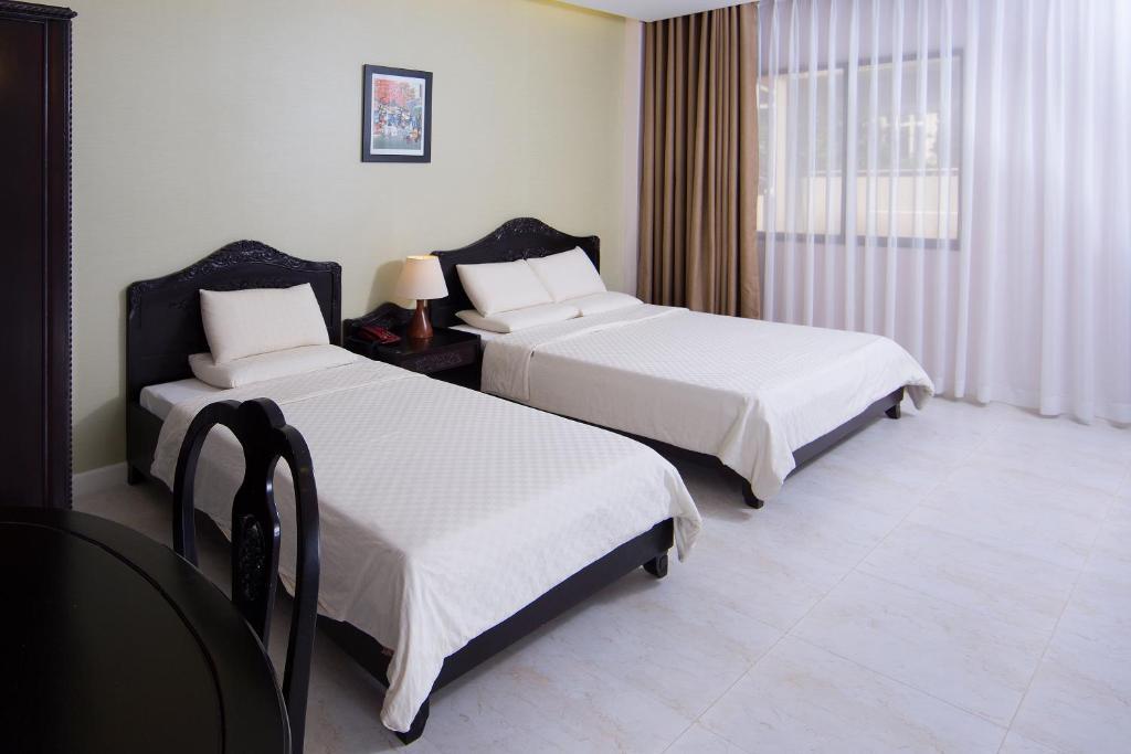 Royal Dragon Boutique Hotel Tan Binh Cidade de Ho Chi Minh Quarto foto